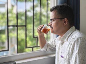 person drinking red tea for brain health