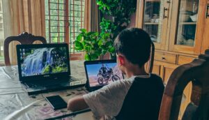 Boy surrounded by gadgets, digital dementia risk