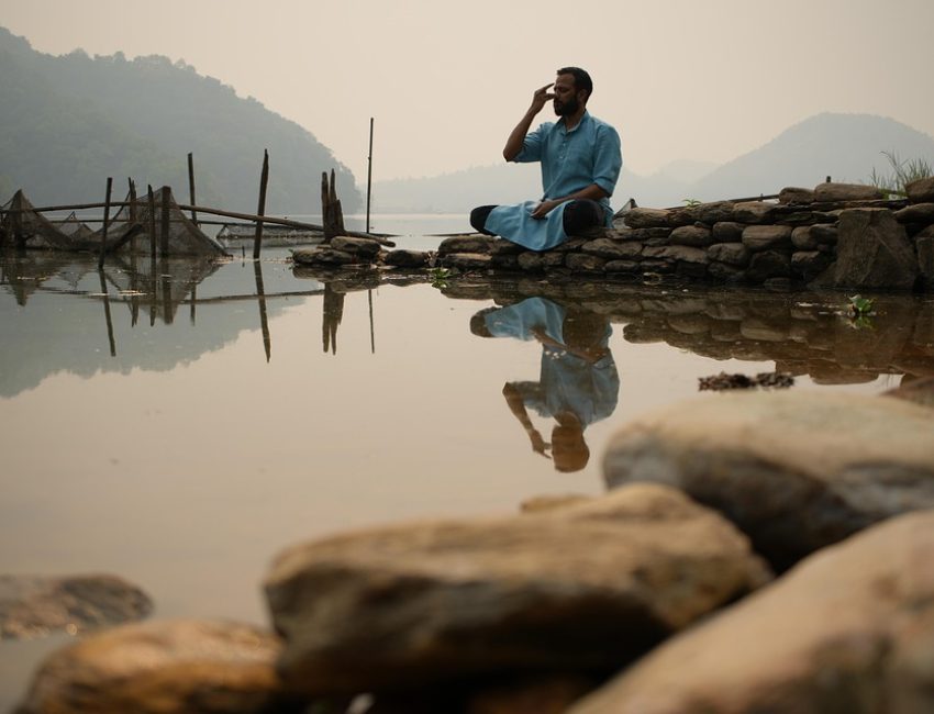 pranam Pranayama for better health-a man practicing pranayama for holistic health